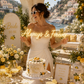Bride at an italian themed bridal shower holding a neon sign that says always & forever