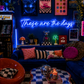 Neon sign that says 'these are the days'  in a retro-themed, maximalist living room with decor elements.